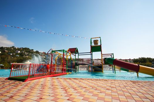 Child's part of waterpark with fountains and tubes