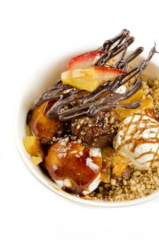 ice cream with chocolate, nuts and caramel close up