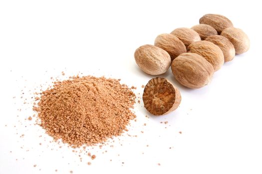 Whole and grated nutmeg isolated on white background