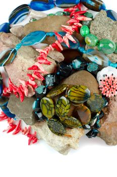Close up of many different colorful natural gems: agate onyx, coral