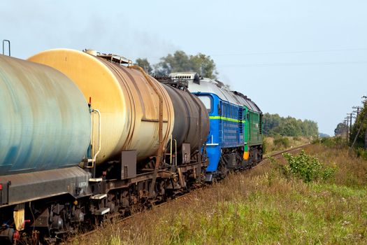 Freight train passing the countryside
