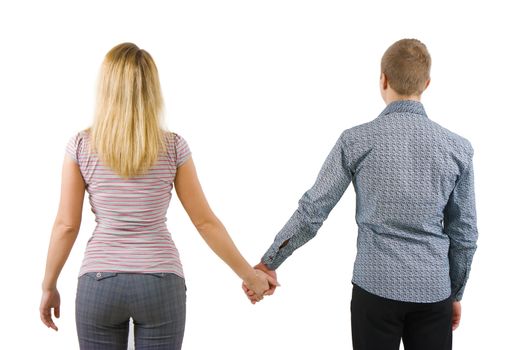 A young couple holding hands back to the camera. Isolated on white background
