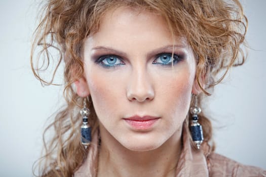 Portrait of a young woman in studio close-up