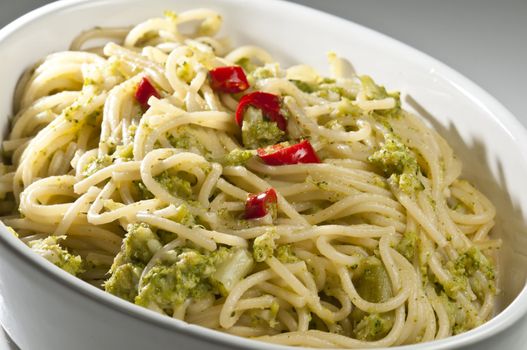 Traditional classic Italian dish of spaghetti with broccoli and hot pepper