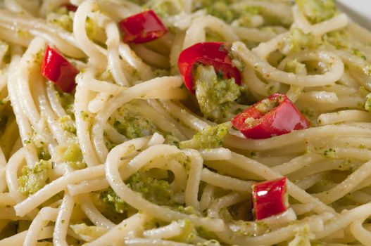 Traditional classic Italian dish of spaghetti with broccoli and hot pepper