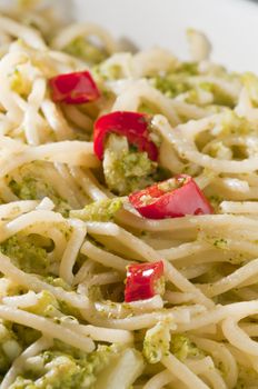Traditional classic Italian dish of spaghetti with broccoli and hot pepper