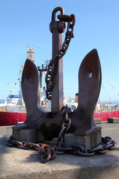 An old large anchor monument in front the maritime museum in Astoria Oregon.