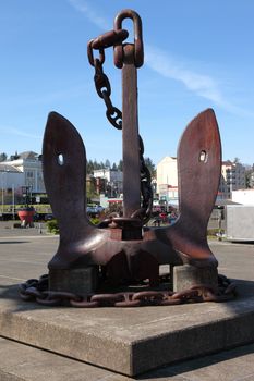 An old large anchor monument in front the maritime museum in Astoria Oregon.