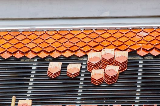 Repairing the roof of a temple in Thailand
