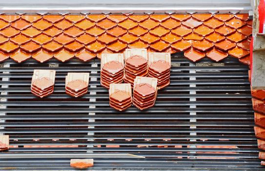 Repairing the roof of a temple in Thailand