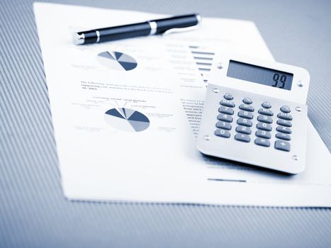 Market Analyze - pen and calculator on papers