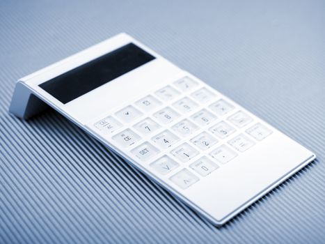 White Calculator On Office Desk