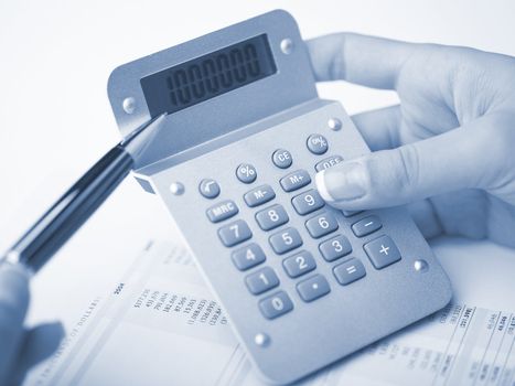 Market Analyze - pen and calculator on papers