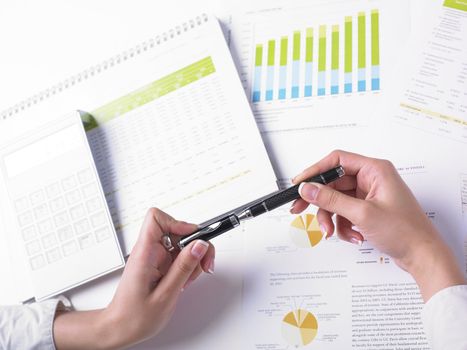 Analyzing Business Data - pen and numbers on paper