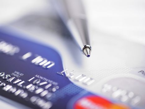 Close up a credit card and pen