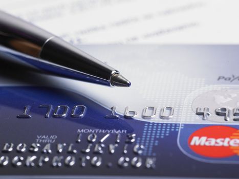 Close up a credit card and pen