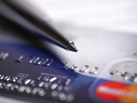Close up a credit card and pen