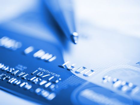 Close up a credit card and pen