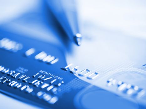 Close up a credit card and pen