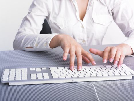 Business Secretary Typing on Computer Keyboard