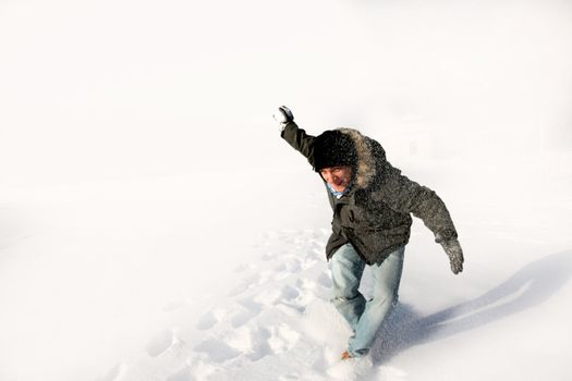 Young man out on a bright winter day