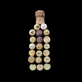 wine corks, laid out in the form of a bottle of wine