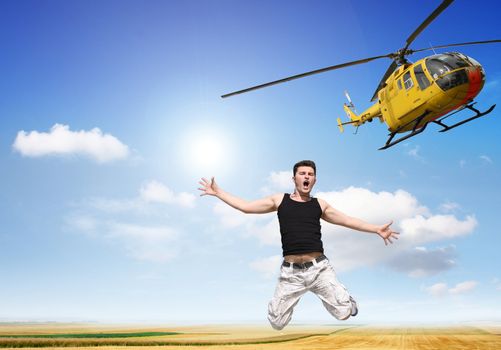 A boy jumps without a parachute from a helicopter