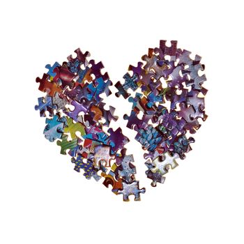 broken heart made from the puzzle , isolated