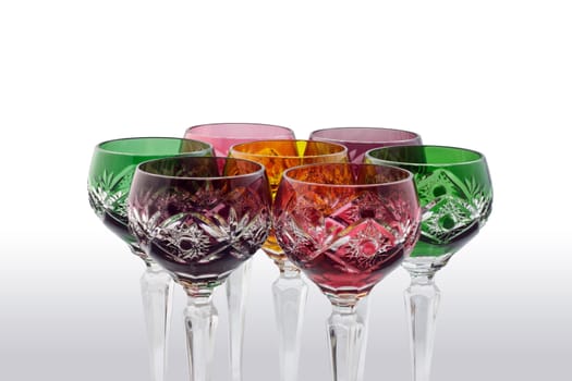 colored crystal wine glasses , isolated .