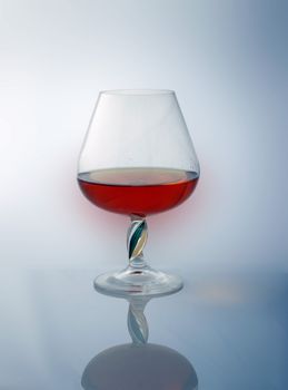 goblet with brandy, reflexion