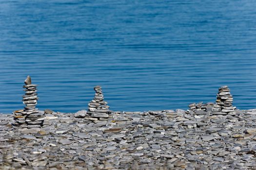 pyramids of stones on the beach, closeup