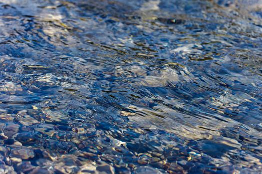 pebbles under water, waves, reflection, textures