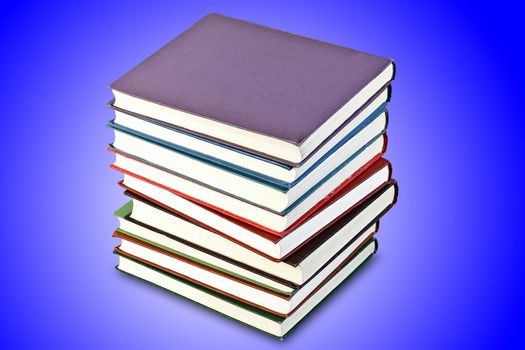 a stack of old books in the blue, isolated