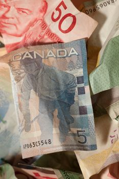 Crumpled Canadian dollar bills close-up, currency crisis concept