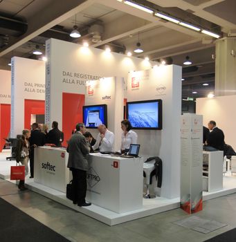 People visit Olivetti technologies stand during SMAU, international fair of business intelligence and information technology in Milan, Italy.