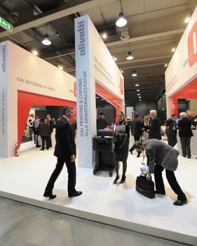 People visit Olivetti technologies stand during SMAU, international fair of business intelligence and information technology in Milan, Italy.