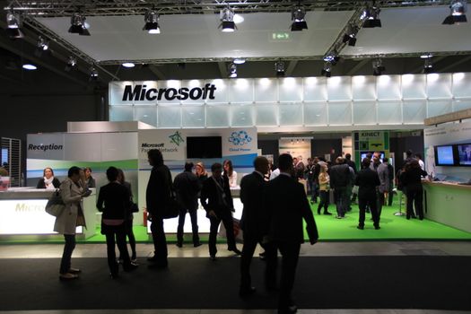 People visit Microsoft technologies stand during SMAU, international fair of business intelligence and information technology in Milan, Italy.