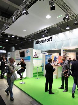 People visit Microsoft technologies stand during SMAU, international fair of business intelligence and information technology in Milan, Italy.