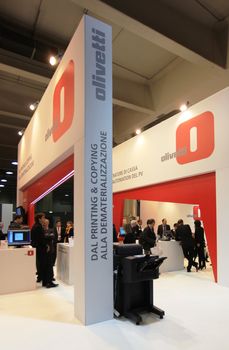 People visit Olivetti technologies stand during SMAU, international fair of business intelligence and information technology in Milan, Italy.