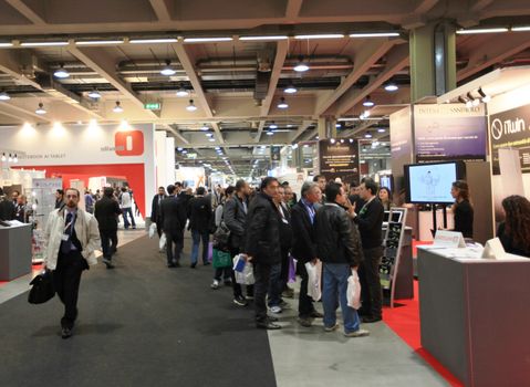 People visit technologies stand during SMAU, international fair of business intelligence and information technology in Milan, Italy.