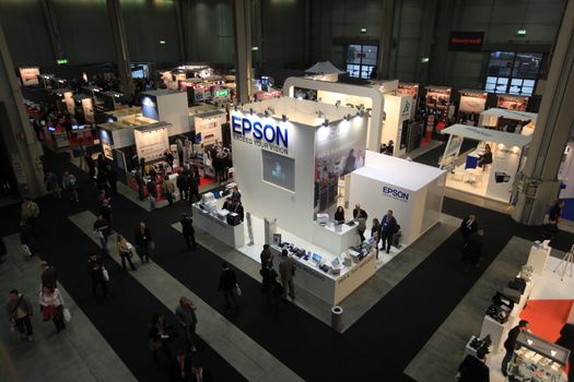 Panoramic view of people visiting technologies stands during SMAU, international fair of business intelligence and information technology in Milan, Italy.