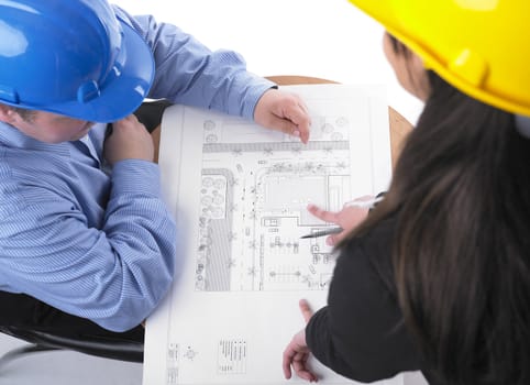Two architects with helmet on meeting
