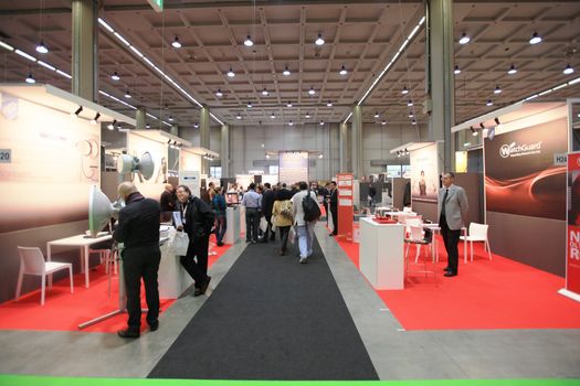 Panoramic view of people visiting technologies stands during SMAU, international fair of business intelligence and information technology in Milan, Italy.