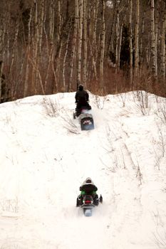 Two people out for a skidoo ride