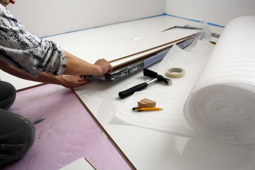 Workers laid laminate in home renovation