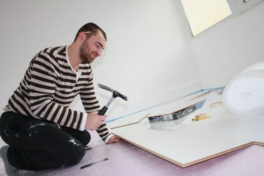 Workers laid laminate in home renovation