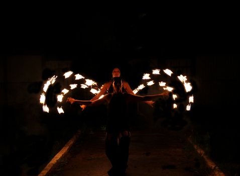 Beautiful dance with fire at night