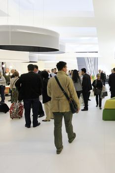 People visit interiors design stands and home architecture solutions at 2011 Salone del Mobile, international furnishing accessories exhibition in Milan, Italy.