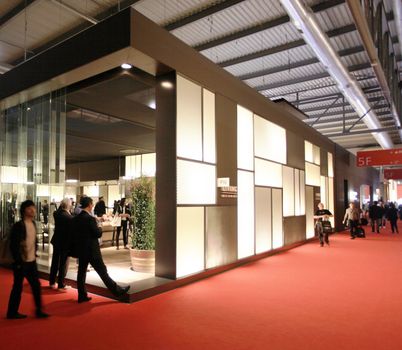 People visit interiors design stands and home architecture solutions at 2011 Salone del Mobile, international furnishing accessories exhibition in Milan, Italy.