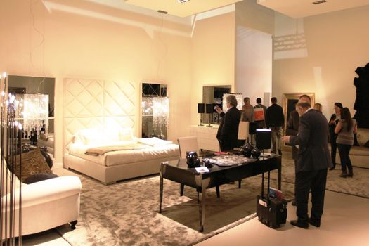 People visit interiors design stands and home architecture solutions at 2011 Salone del Mobile, international furnishing accessories exhibition in Milan, Italy.